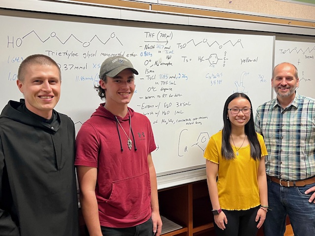 (From left) Fr. Michael Antonacci, Tony Sparta, Angelina Bucci and Dr. Jason Vohs pose in the lab at Saint Vincent College